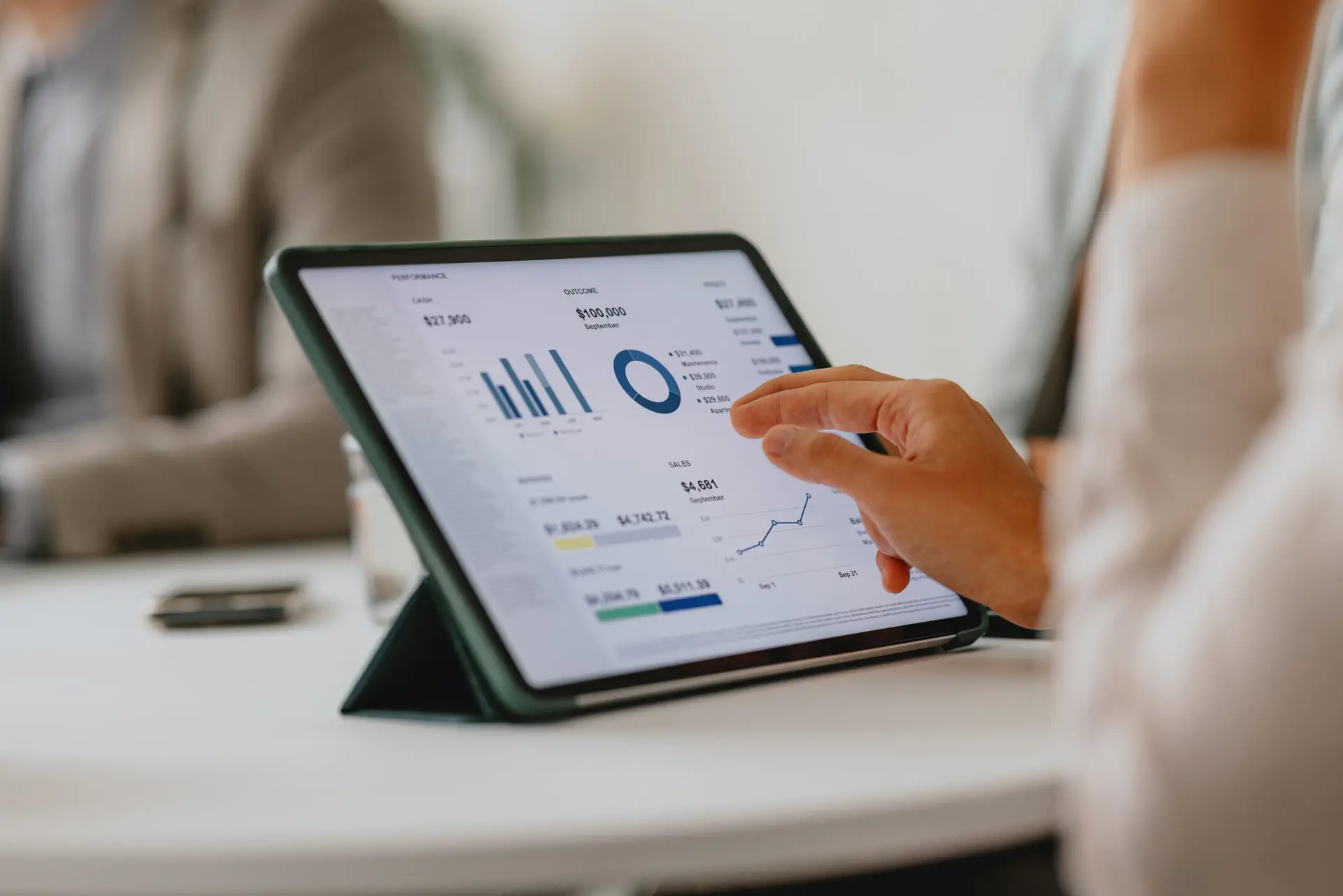 business team analyzing data on digital tablet during meeting